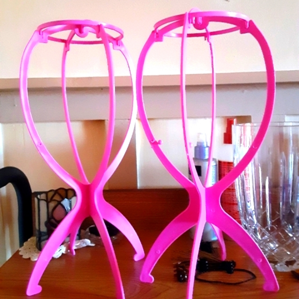 (Sold) Two wig stands/holders in hot pink. Price firm with discounted shipping.